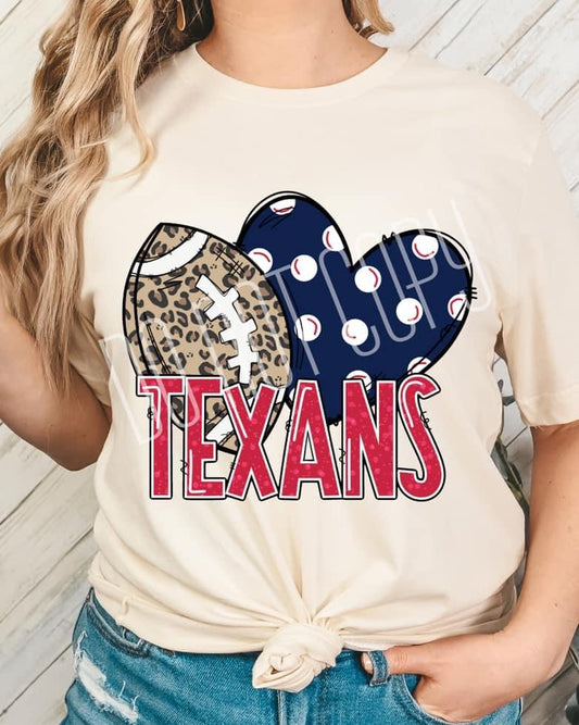 A person wearing a beige t-shirt with a heart and leopard print design, featuring text that says 'Texans' and a football icon.
